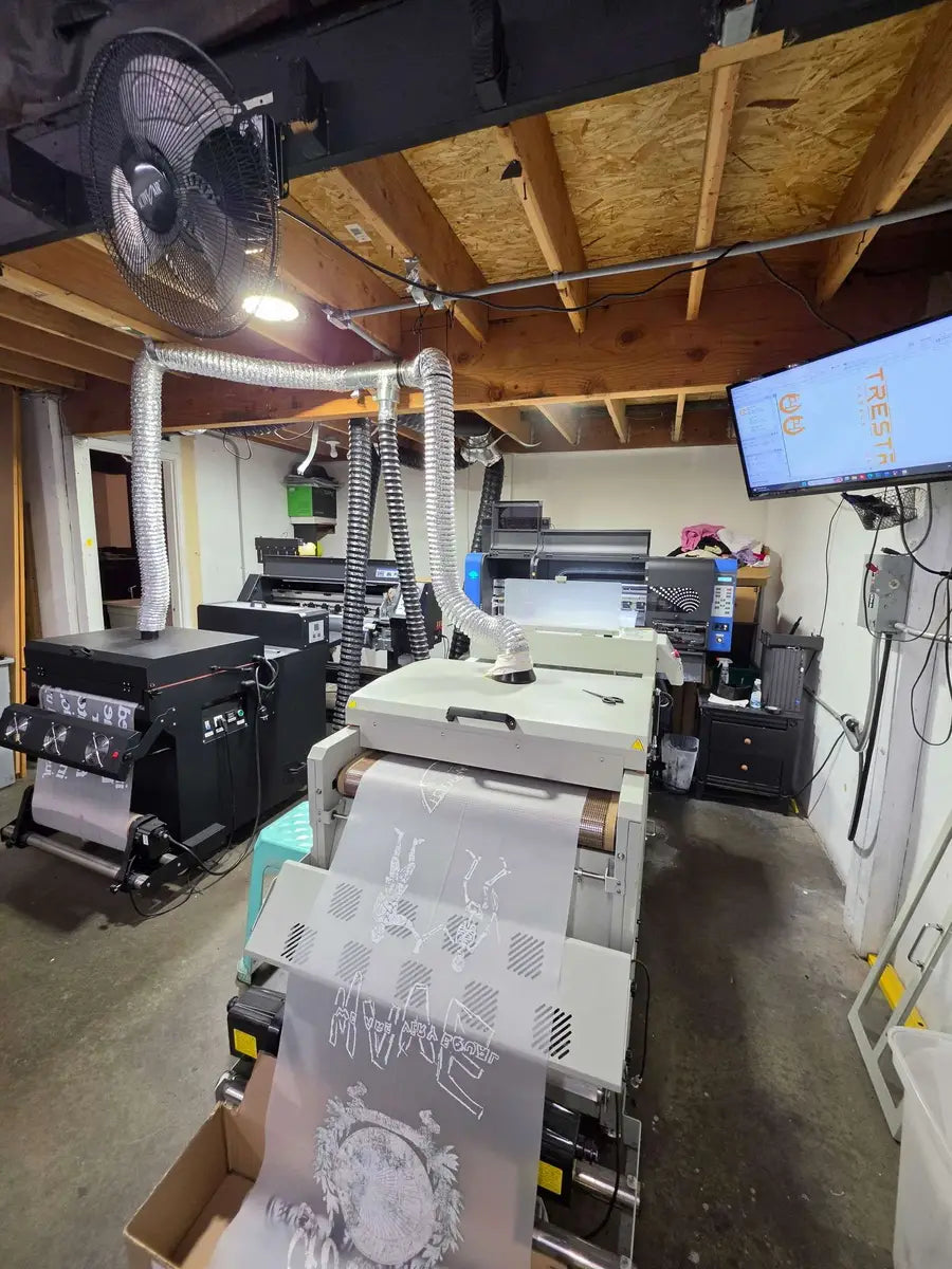 Direct-to-film production room setup with transfer film printer and curing equipment