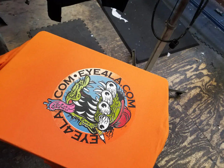 Orange printed Eye4LA shirt produced by DARTMAR